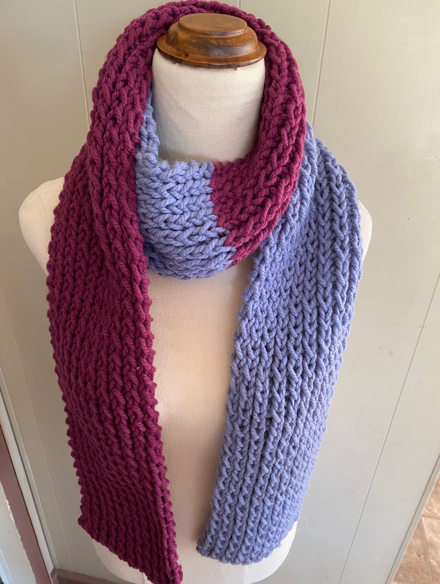 Genuinely hand knitted scarf in magenta and blue