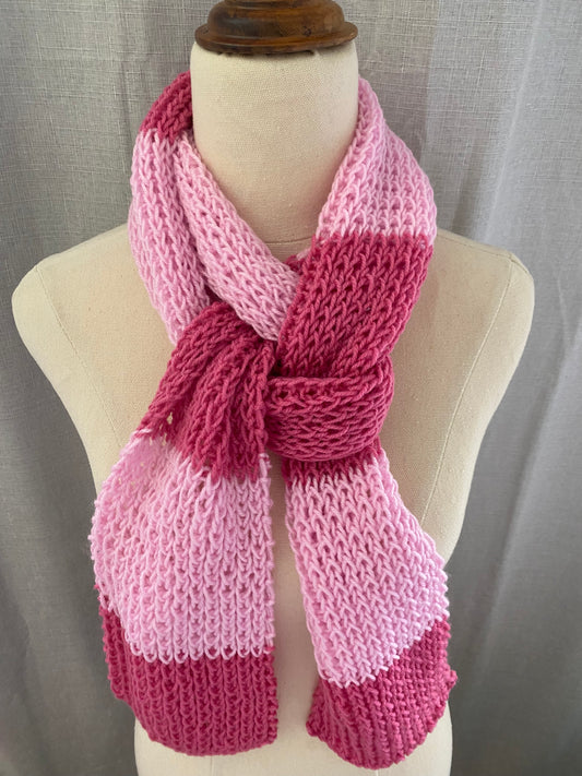 Genuinely hand knitted scarf in rose and berry pink