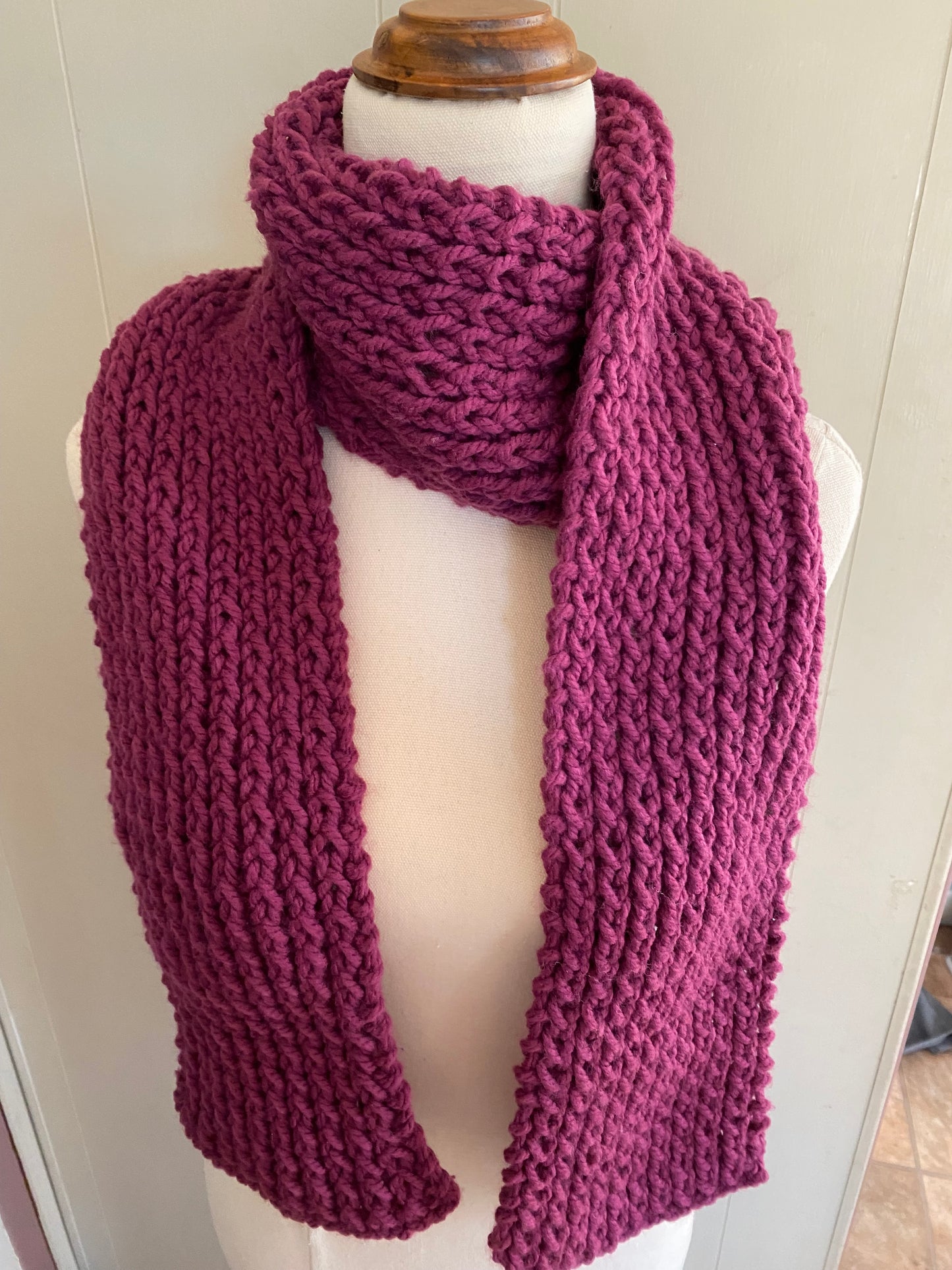 Genuinely hand knitted scarf in magenta